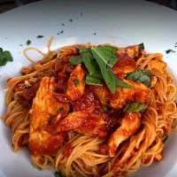 Capellini al Pomodoro · Angel hair pasta, garlic, and fresh basil tomato sauce.
