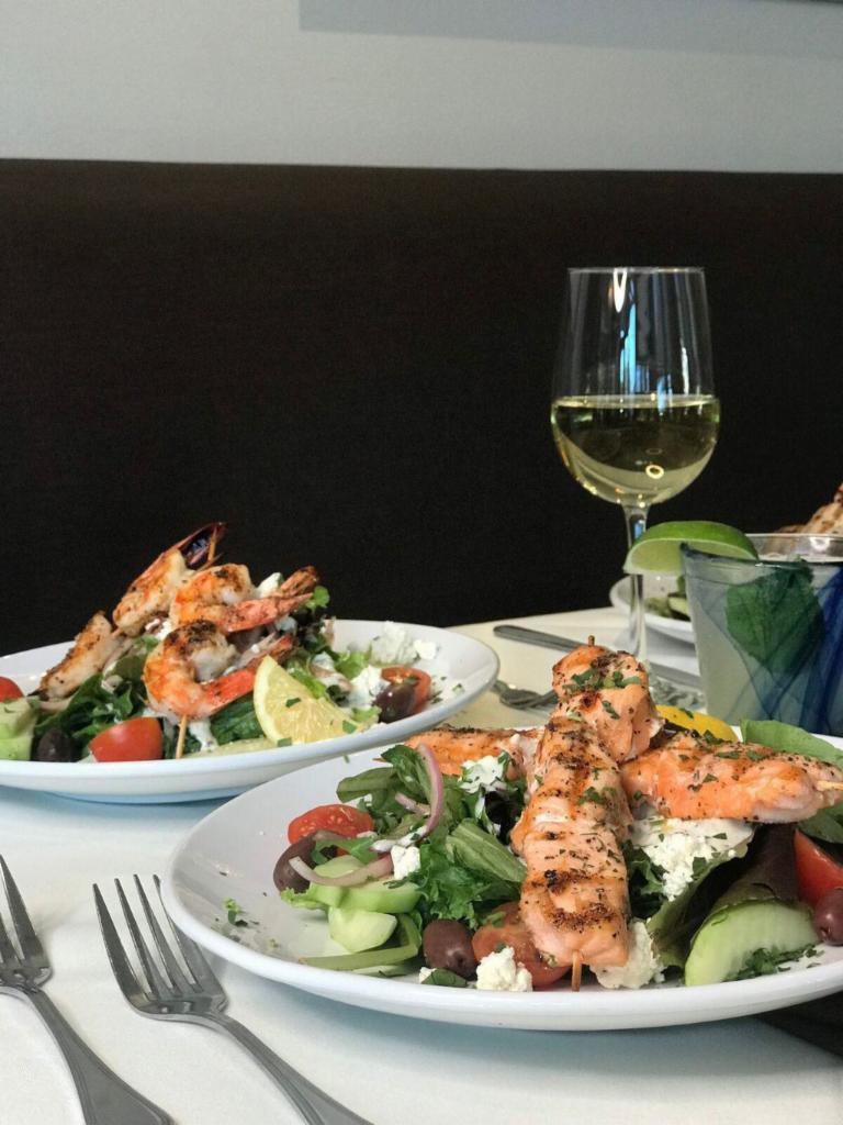 Salmon Salad Dinner · Ziziki’s salad topped with skewered and grilled sushi grade fillet of salmon.