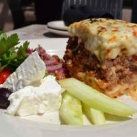 Moussaka Dinner · Comes with seasoned lamb layered with bechamel, eggplant and potatoes.