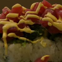 Stanford Roll · 9-10 pieces. Crab salad, cucumber, mango, top with tuna and seaweed salad.