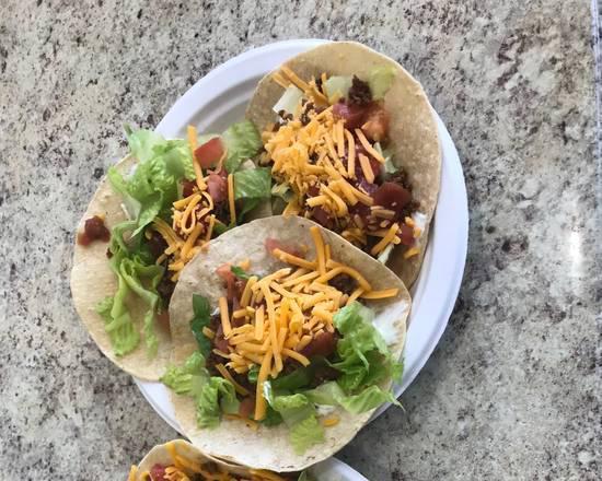 Vegan Beef Taco · Vegan beef, romaine lettuce, tomato, shredded cheddar, and sour cream wrapped in a warm flour tortilla. (3 tacos)