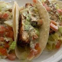 Vegan Fish Taco · Vegan tartar sauce, lettuce, tomato, and diced avocado wrapped in a warm flour tortilla. (2 ...