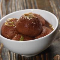 Gulab Jamun · Dumplings, dried milk, cardamom syrup.