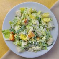 Caesar Salad · Green salad with Caesar dressing and cheese.