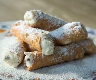 Cannoli · Italian pastries , filled with a sweet cream and chocolate chips