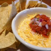 Buffalo Chicken Dip · Unbelievable Buffalo Chicken Dip topped with grated mixed cheeses and fresh  pico de gallo. ...