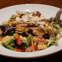 Greens 'n Grilled Salad · Grilled chicken breast nestled on top of our mixed greens with shredded Monterey Jack and ch...