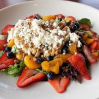 Fresh Berry Salad · Grilled chicken breast served over mixed greens with candied roasted pecans, fresh blueberri...