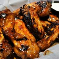 10 Grilled Wings · No breading - grilled and sauced.
