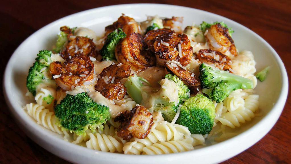 Cajun Alfredo Pasta · Cajun grilled shrimp or chicken and steamed broccoli served over fusili pasta in a spicy Cajun cream sauce topped with grated Parmesan cheese.