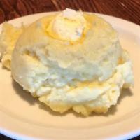 Mashed Potatoes · Whipped, buttery mashed potatoes.