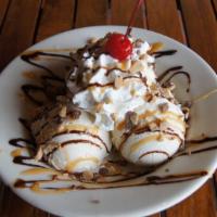 Brownie Sundae · A warm, soft fudge brownie with vanilla ice cream topped with a river of chocolate syrup and...