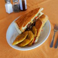 Bistec Sandwich · Steak sandwich. Thinly slice steak full of flavor with Swiss cheese, peppers and onions.