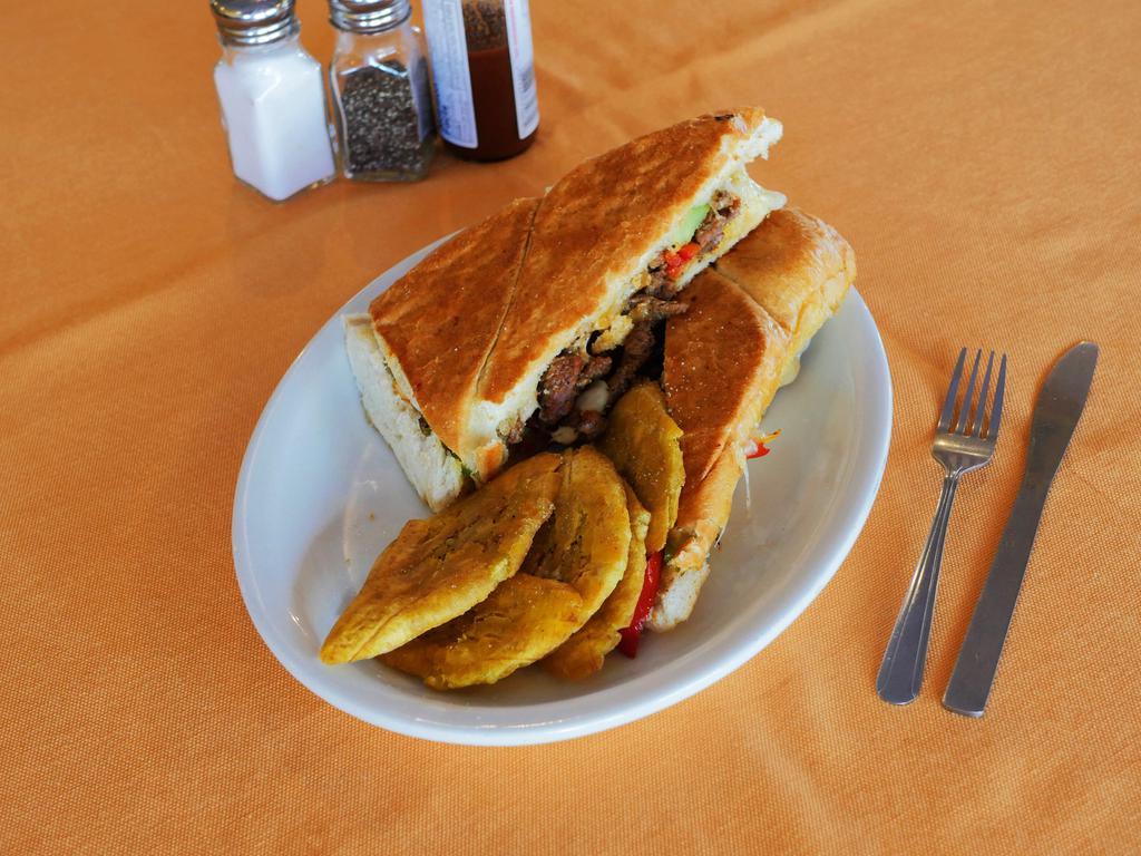 Bistec Sandwich · Steak sandwich. Thinly slice steak full of flavor with Swiss cheese, peppers and onions.