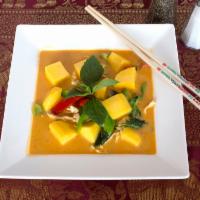 Sp1. Mango Curry · Choice of chicken, pork or tofu with mango, bell peppers and basil leaves simmered in red cu...