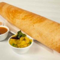 Masala Dosa · From the Coromandel Coast. A paper-thin rice and lentil crepe stuffed with spiced potatoes a...