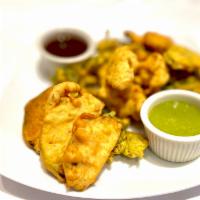 Vegetable Platter · An assortment of vegetable bhajia (eggplant, potato, cauliflower, spinach and onion fritters...