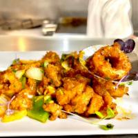 Calamari Coromandel · Calamari stir fried with onions, bell pepper, garlic and garnished with curry leaves. Contai...