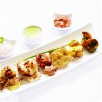 Coromandel Platter · An assortment of kalmi kebab, murgh tikka, kakori kebab, malai kebab and sunhari potli. Cont...