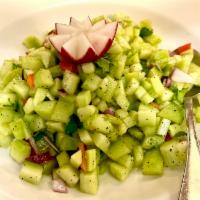 Kachumber salad · Cubes of cucumber, carrots, red onion, tomato with lemon dressing