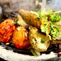 Satrangi Kebab · Medley of chicken, lamb chop, kakori kebab, shrimp and vegetable kebabs. 
Has cashew nuts 