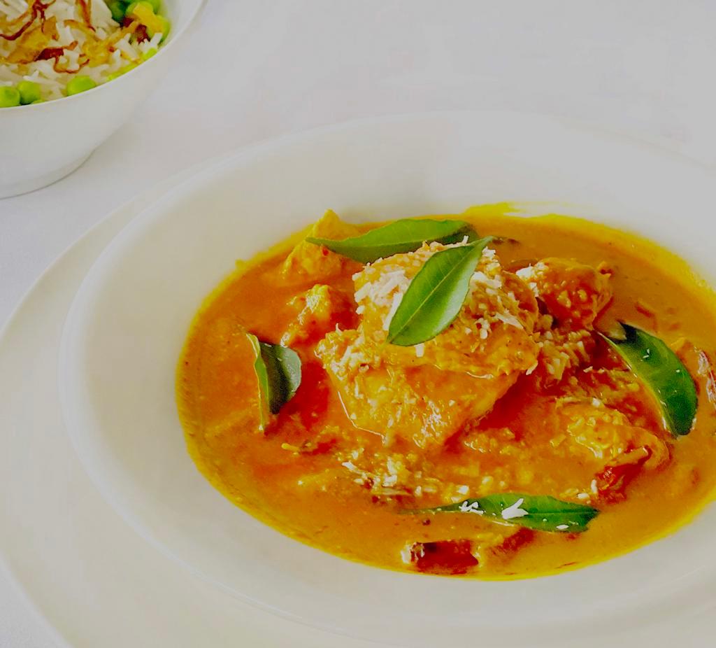 Chicken Madras · Chicken chunks stewed in hot coconut curry sauce, red chilies and mustard seeds. Medium spicy. 
