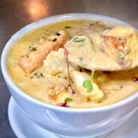 Navaratan Korma · Assorted vegetables stewed in a mildly spiced creamy cashew and almond sauce.