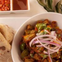 Bhindi Do Pyaza · Fresh okra cooked with onions, ginger, tomatoes, herbs and spices. Northwestern specialty. V...