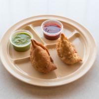Paneer Pakoras · Homemade cottage cheese with chickpea batter, deep fried. Served with mint sauce and tamarin...