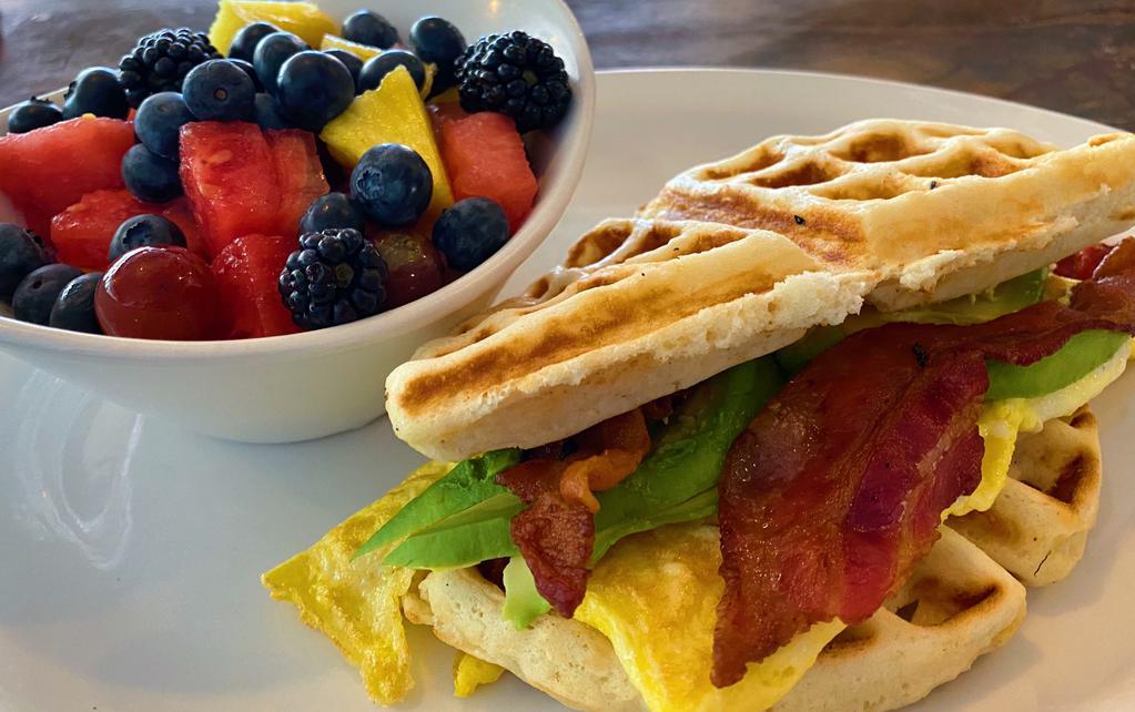 Waffle Sandwich · Fresh Belgian waffle stuffed with scrambled eggs, bacon and avocado. Served with choice of potatoes.