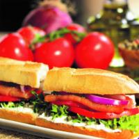 #18. Smoked Salmon Sandwich · Artisanal cream cheese, tomatoes, red onions, capers, fresh dill, extra virgin olive oil, le...