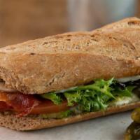 #14. Applewood Bacon Sandwich · Goat Gouda, tomatoes, avocado, rosemary aioli and greens.