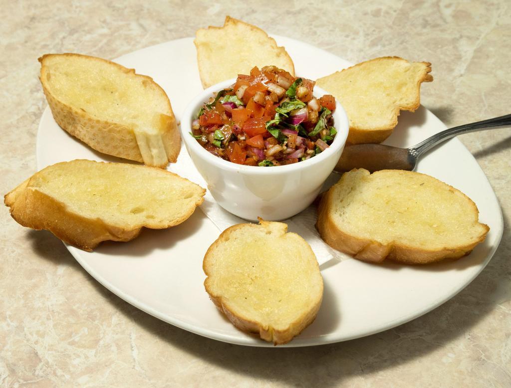 Bruschetta · Sliced fire baked Italian bread topped with olive oil, fresh chopped red onion, tomato and basil.