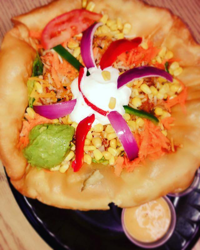 Taco Salad [Chicken ] · Fried tortilla bowl. Served with lettuce, chicken, black beans, guacamole, tomatoes, sour cream, red onions kernels, green peppers and fancy shredded cheese.