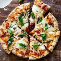 Margherita Pizza  ·  This pizza has our signature red sauce, fresh sliced mozzarella cheese & basil.