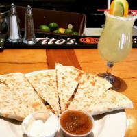 Quesadilla · Shredded jack and cheddar cheese, green chiles, salsa, sour cream. Add meat for an additiona...