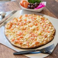 Greek Flatbread · Flatbread with tomatoes, onions and feta cheese.