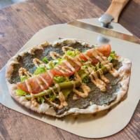 Kebab Flatbread · Flatbread spread with minced beef, parsley and onions, served with lettuce, tomatoes, pickle...