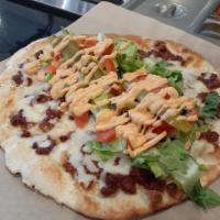 Soujouk and Cheese Flatbread · Spicy Lebanese sausage and mozzarella cheese on a flatbread, served with lettuce, tomatoes, ...