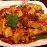 Braised Tofu with Veggies · Lightly browned in fat and then cooked slowly in a closed pan with a small amount of liquid.