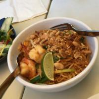 Pad Thai Noodles · Stir-fried rice noodles with tofu, egg and bean sprouts topped with crushed peanuts.