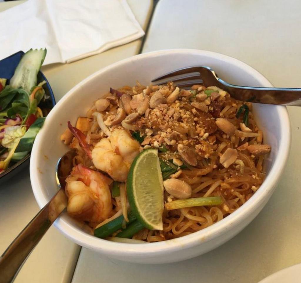 Pad Thai Noodles · Stir-fried rice noodles with tofu, egg and bean sprouts topped with crushed peanuts.