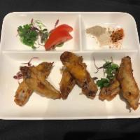 Asian Wings · Deep-fried chicken wings (4 pcs) with Asian seasoning
