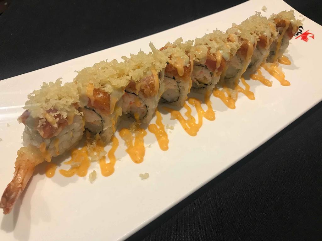 Volcano Special Roll · Shrimp tempura & snow krab mix rolled in seaweed & rice. Topped with spicy daily fish & crunchy flakes mix. Finished with spicy mayo, wasabi mayo, & micro greens
