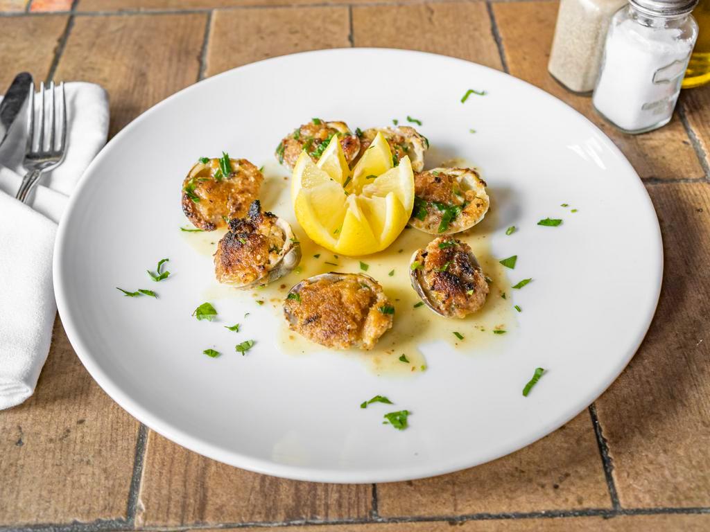 Clams Oreganata · Oven baked clams with seasoned bread crumbs and lemon essence sauce.