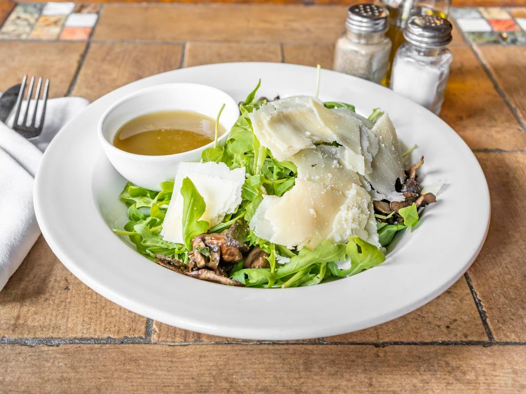 Insalata Rucola and Parmigiano · Arugula, mushrooms, shaved Parmigiano cheese and lemon vinaigrette. Dressing served on the side.