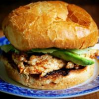 Grilled Chicken Sandwich  · Topped with avocado on a country roll with basil oil & balsamic vinegar, served with in-hous...