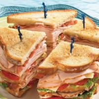 Traditional Turkey Club Sandwich  · Triple decker turkey, bacon, lettuce & tomato.