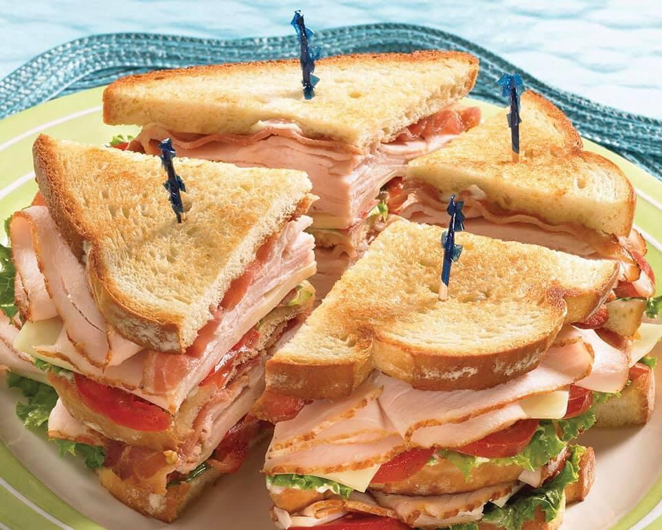 Traditional Turkey Club Sandwich  · Triple decker turkey, bacon, lettuce & tomato.