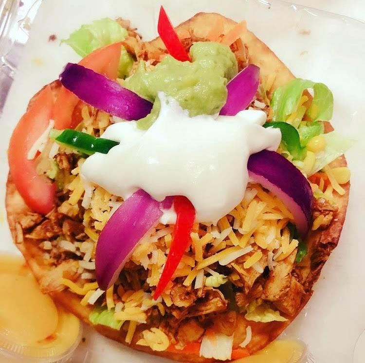 Taco Salad · Fried tortilla bowl. Served with lettuce, chicken, black beans, guacamole, tomatoes, sour cream, red onions kernels, green peppers and fancy shredded cheese.